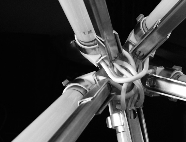 steffi bühlmaier steffibuehlmaier - lichtobjekt - lamp design - diamant - brass frame with fluorescent tubes - cables