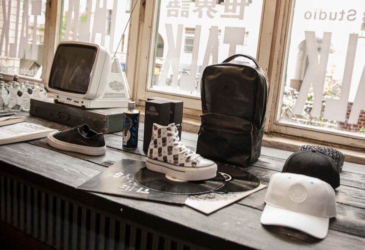 steffi b&uuml;hlmaier steffibuehlmaier - converse - shop styling props - shoes and caps and backpack on table