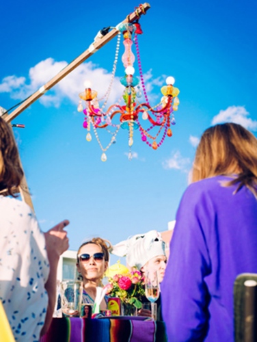 steffi b&uuml;hlmaier steffibuehlmaier - moby m&ouml;we - music video - friends party with chandelier in front of blue sky