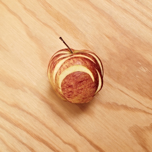 steffi b&uuml;hlmaier steffibuehlmaier - obstsalat - fruit art: apple on wood - stefanie manns