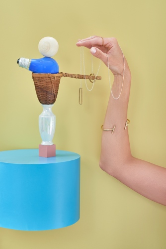 steffi b&uuml;hlmaier steffibuehlmaier - hands on - jewelry sill life with hand and necklace - blue plinth - christian angl