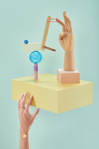 steffi b&uuml;hlmaier steffibuehlmaier - hands on - jewelry installation with human hand and wooden hand, yellow box - christian angl